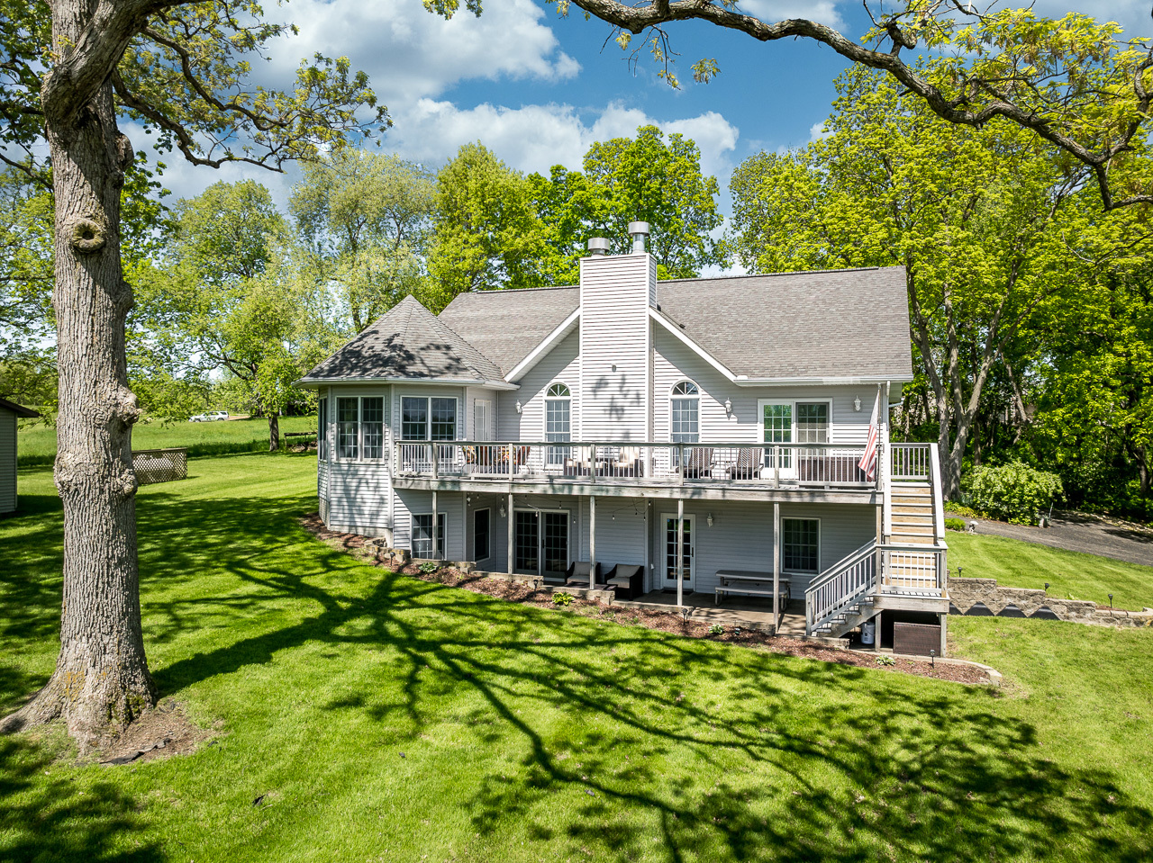 aerial view of a house with a yard table and chairs