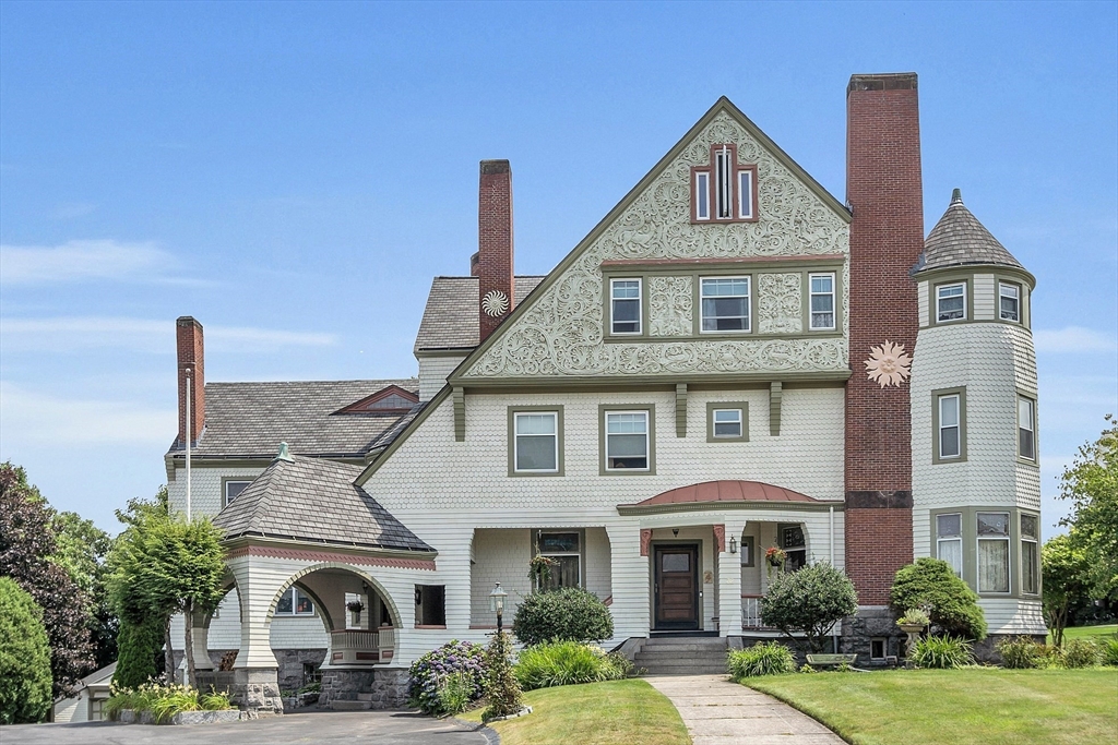 a front view of a house with garden