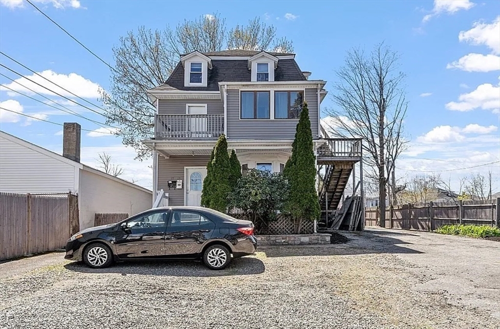 a car parked in front of a house