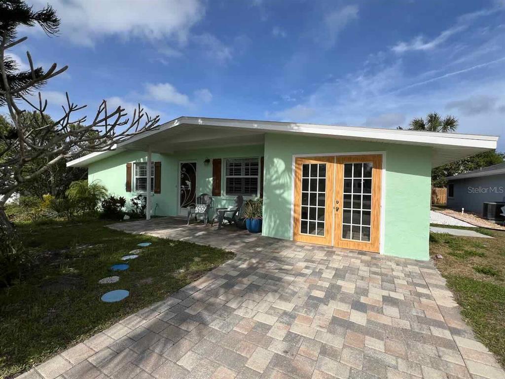 a view of a house with outdoor space porch and furniture