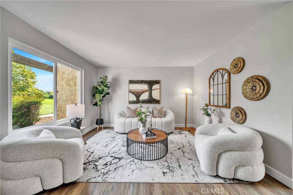 a living room with furniture and a large window