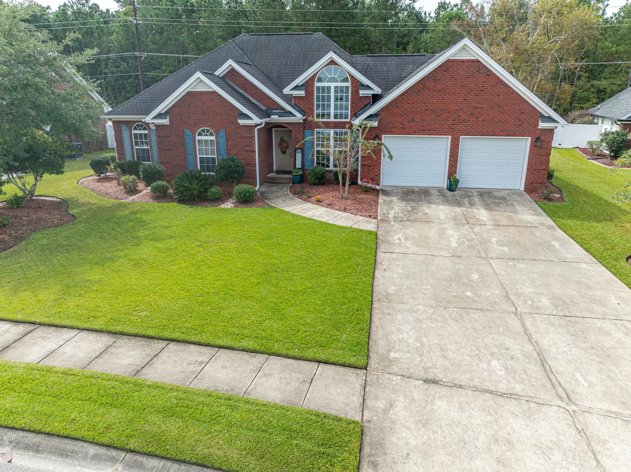 View of front of property featuring a garage and a