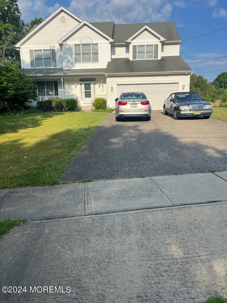 a view of multiple houses with a yard