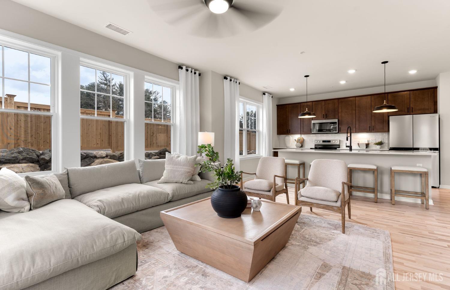 a living room with furniture and a large window