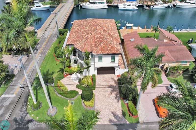 an aerial view of a house with outdoor space lake view and lake view