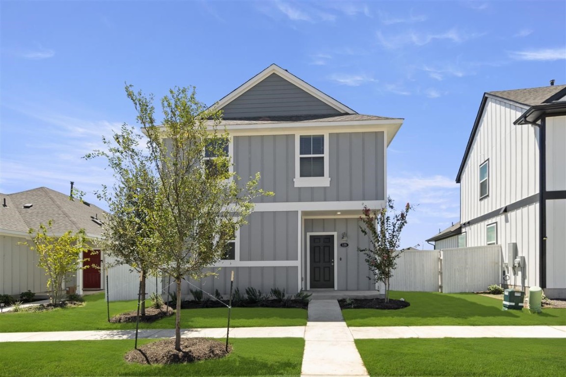 a front view of a house with a yard