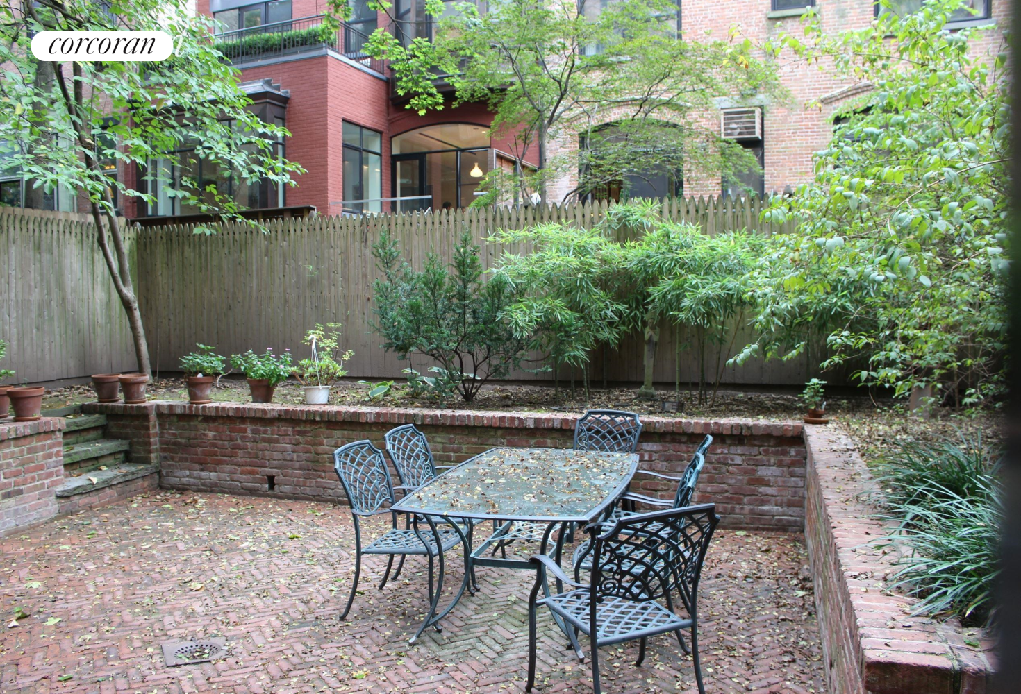 an outdoor sitting area with furniture