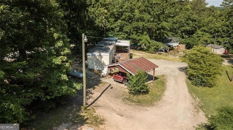 an aerial view of a house with a yard