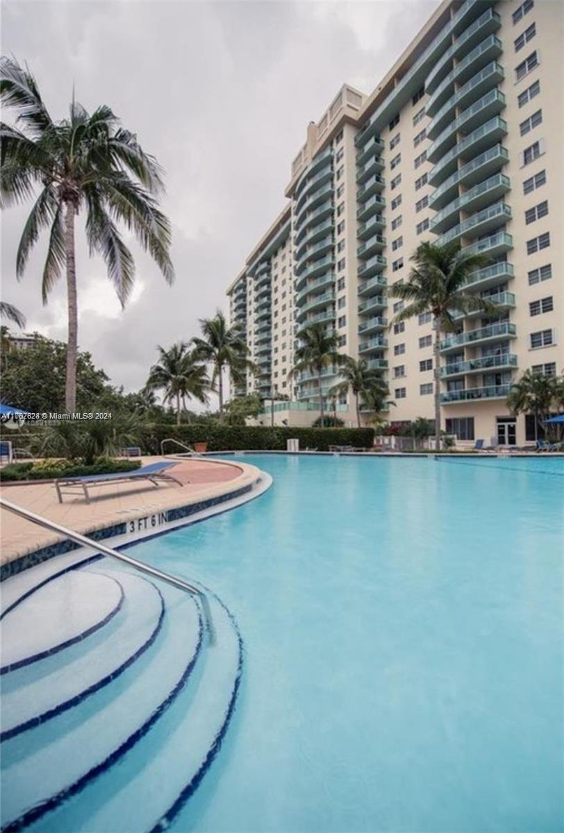 a view of a swimming pool with a chair