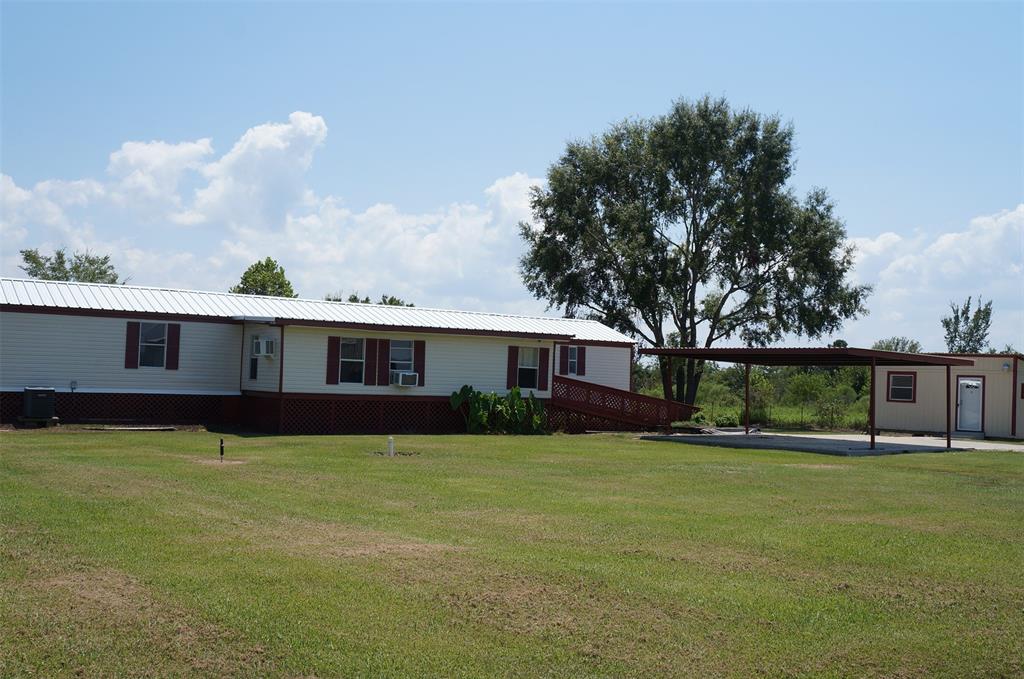 a view of a yard in front of a house