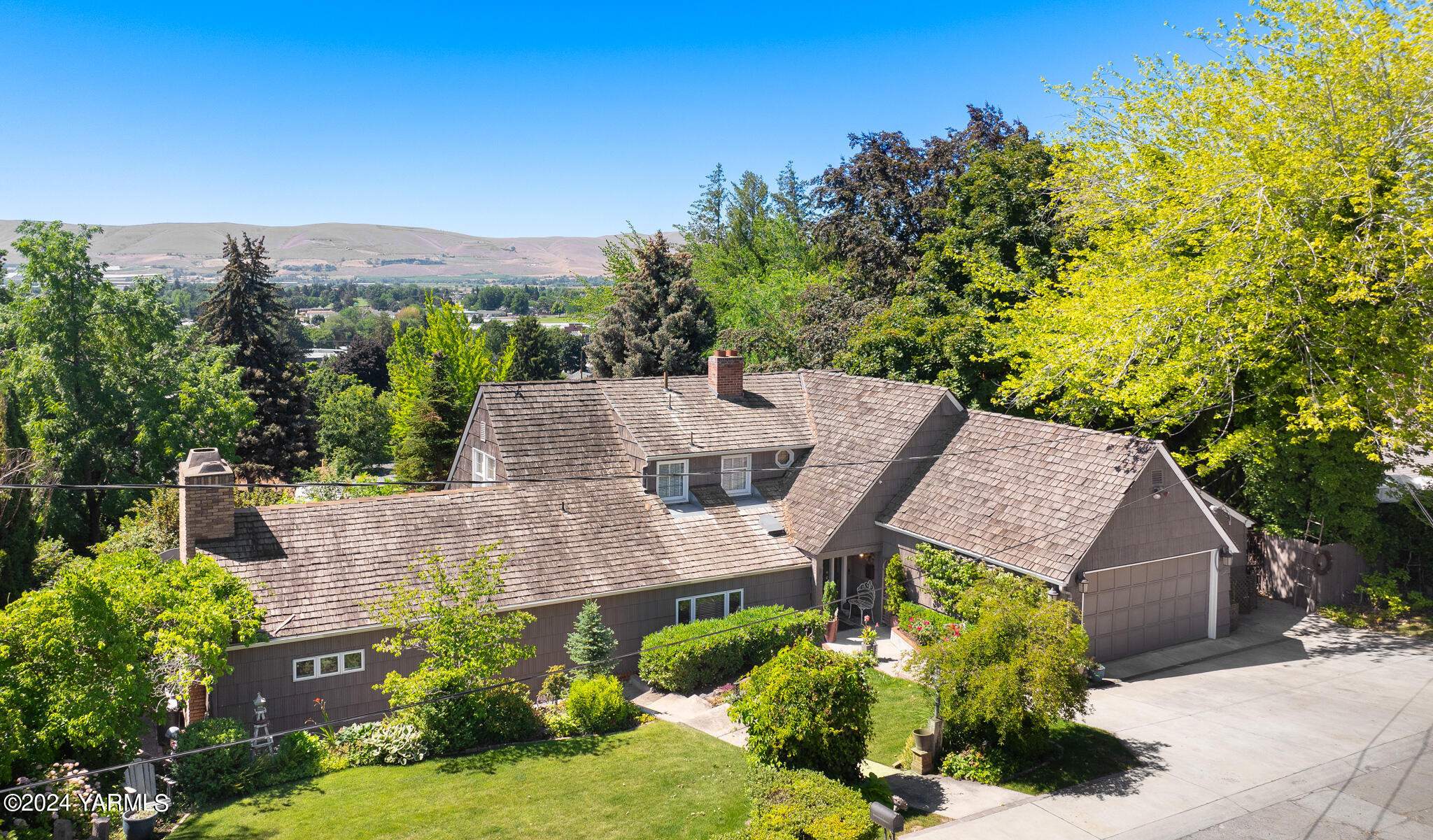 an aerial view of a house with a garden