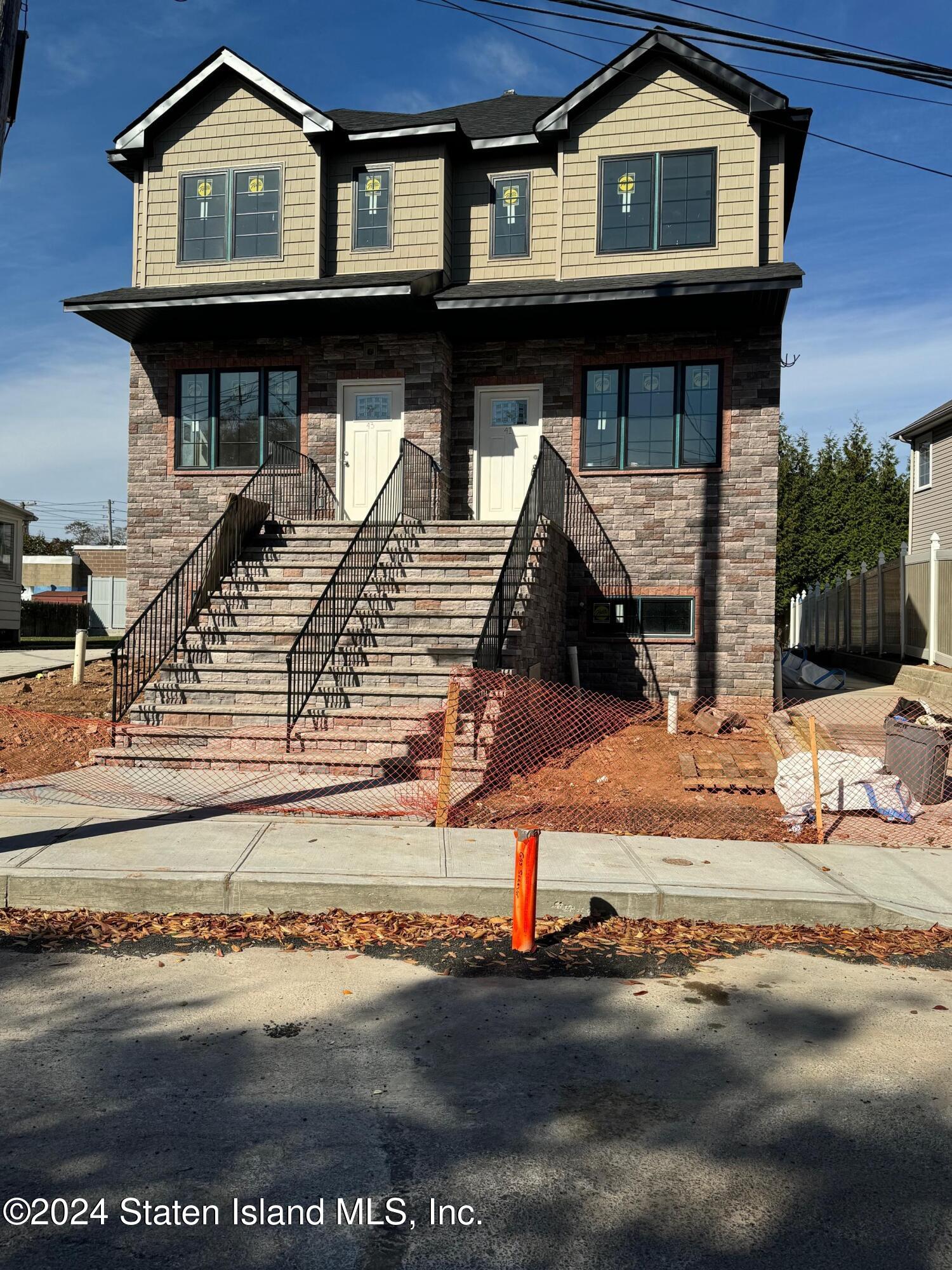 a front view of a house with garage