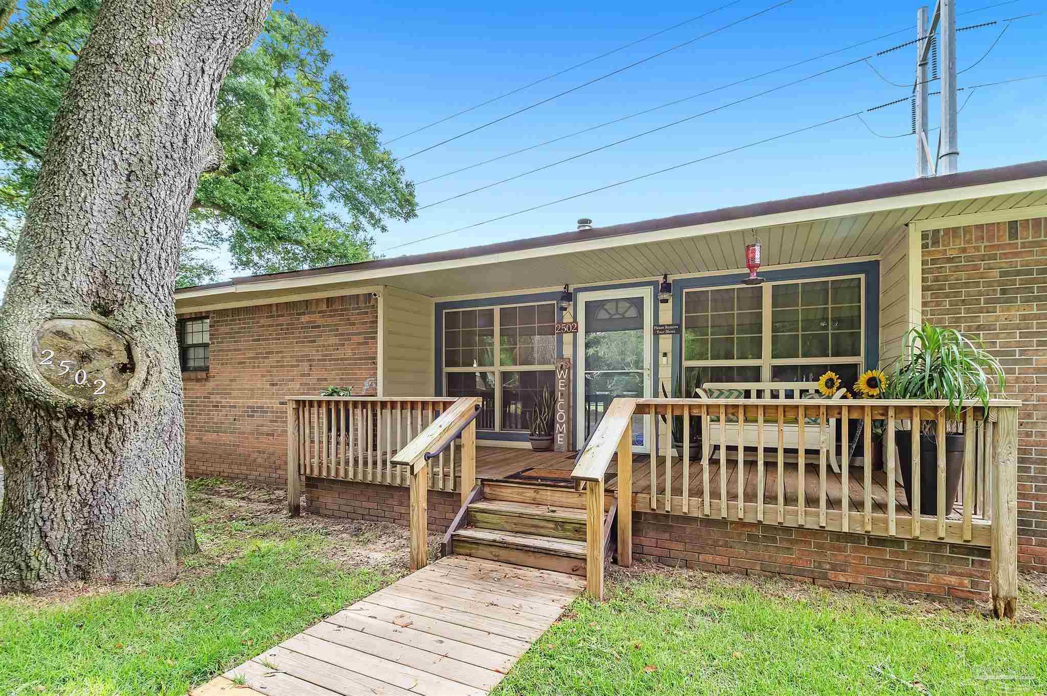 a front view of a house with a porch