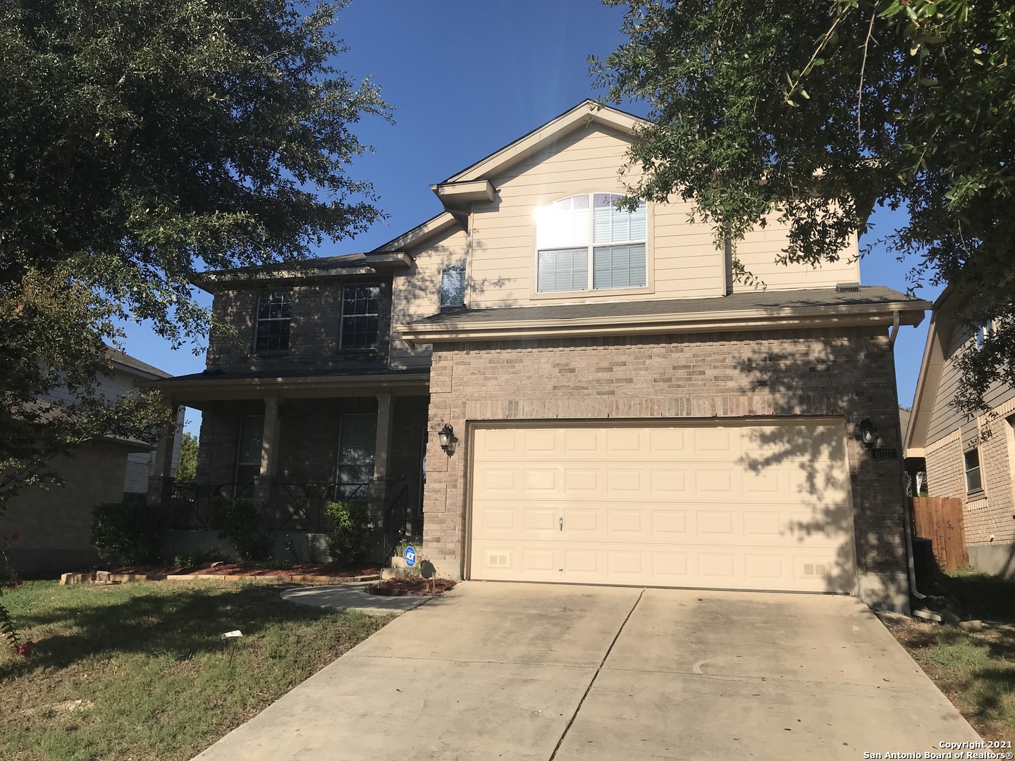 front view of a house with a yard