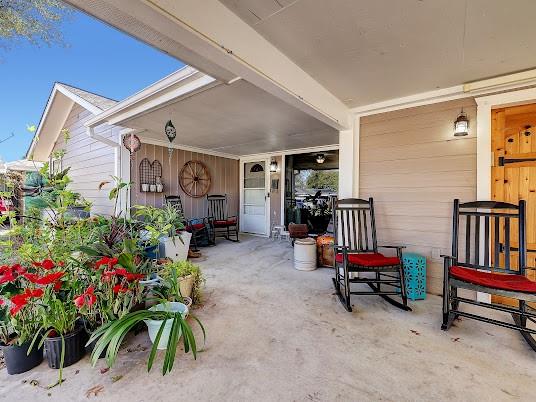 This inviting porch and carport are waiting to greet you home.