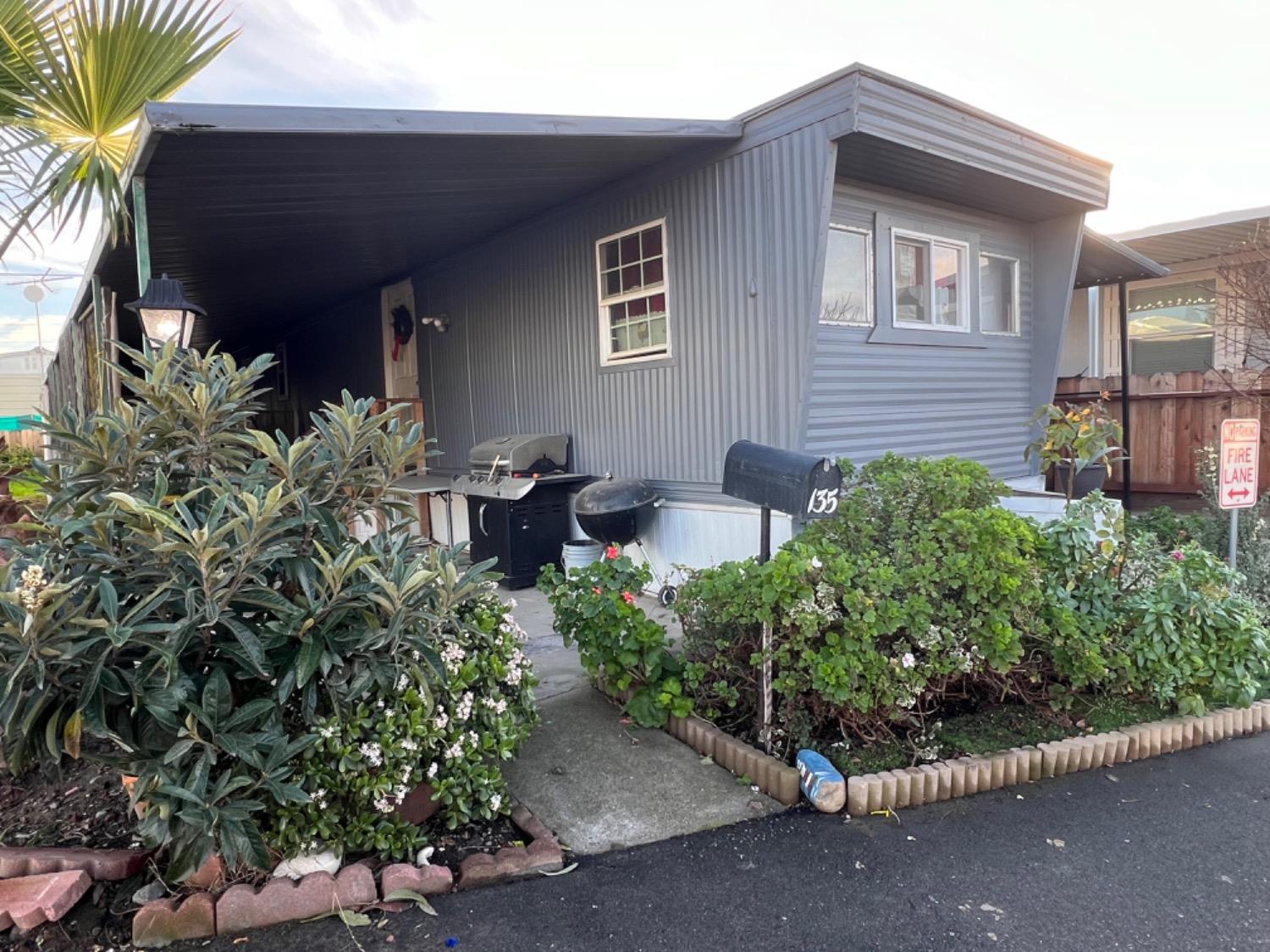 a couple of potted plants in front of door