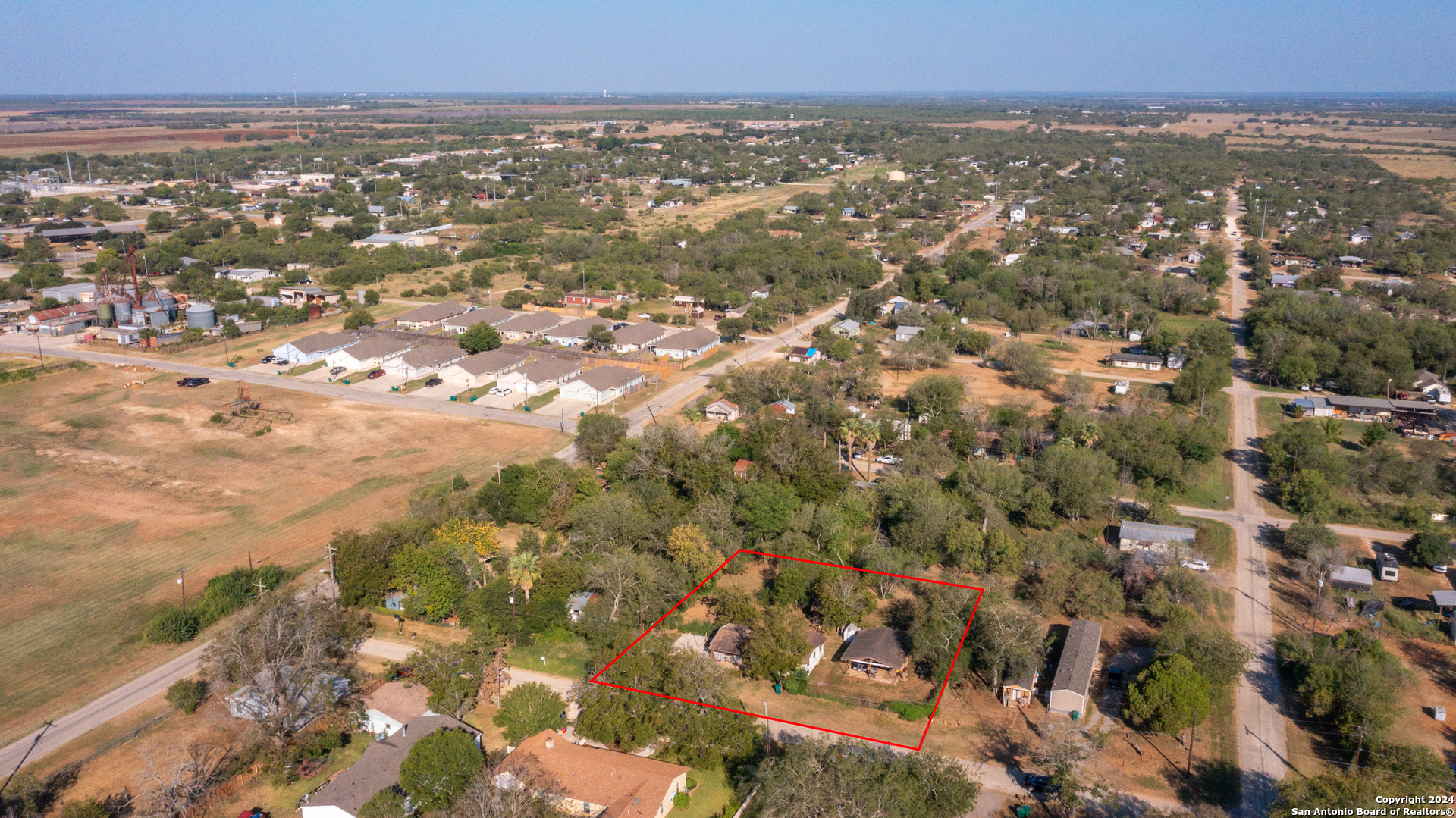 an aerial view of residential building with parking space