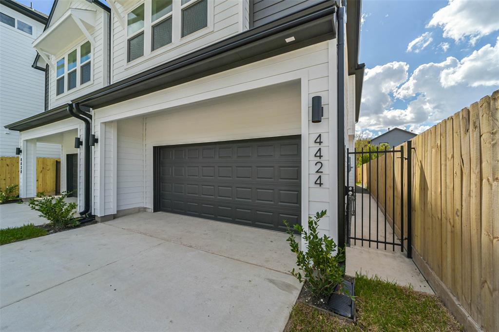 a front view of a house with garage