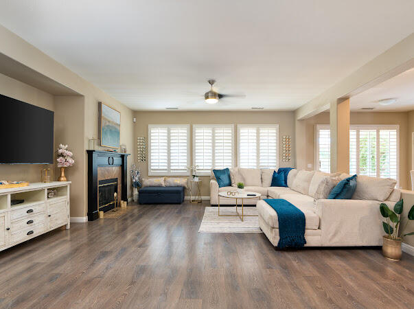 a living room with furniture and a flat screen tv