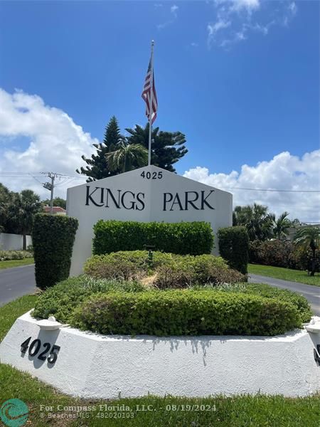 a view of sign board with flower around