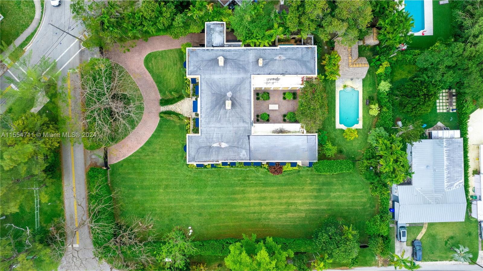 an aerial view of a house with a garden