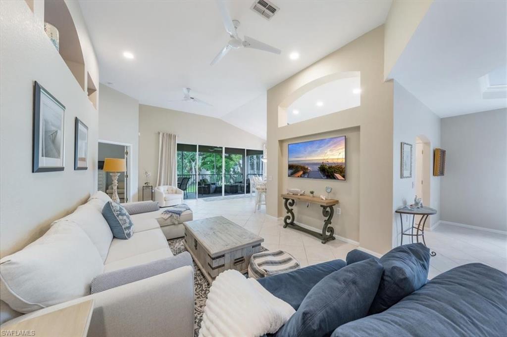 open living area with volume ceilings