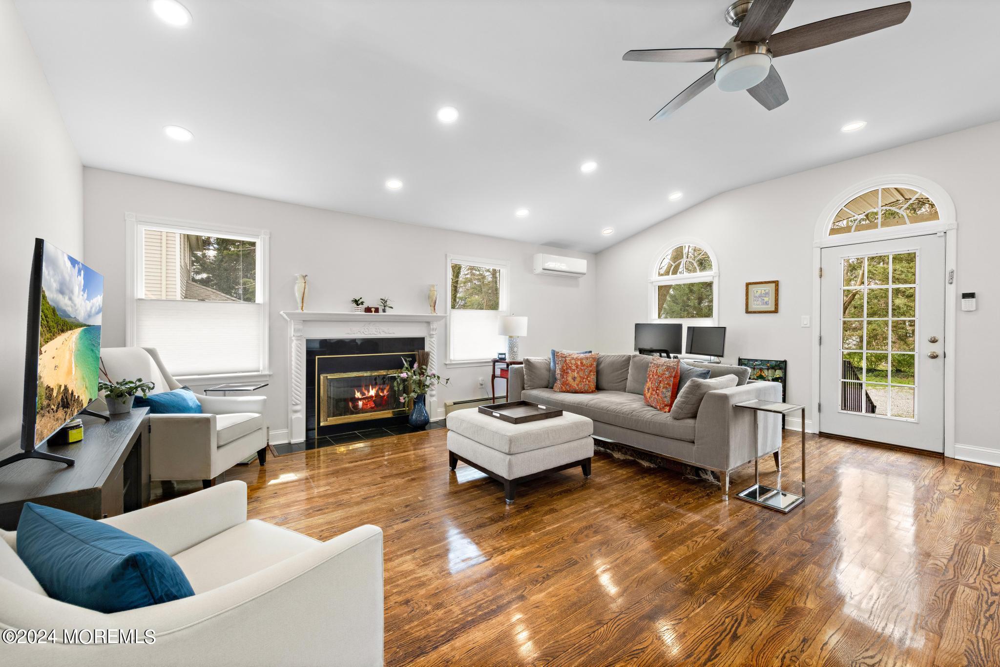 a living room with furniture or fireplace and a wooden floor