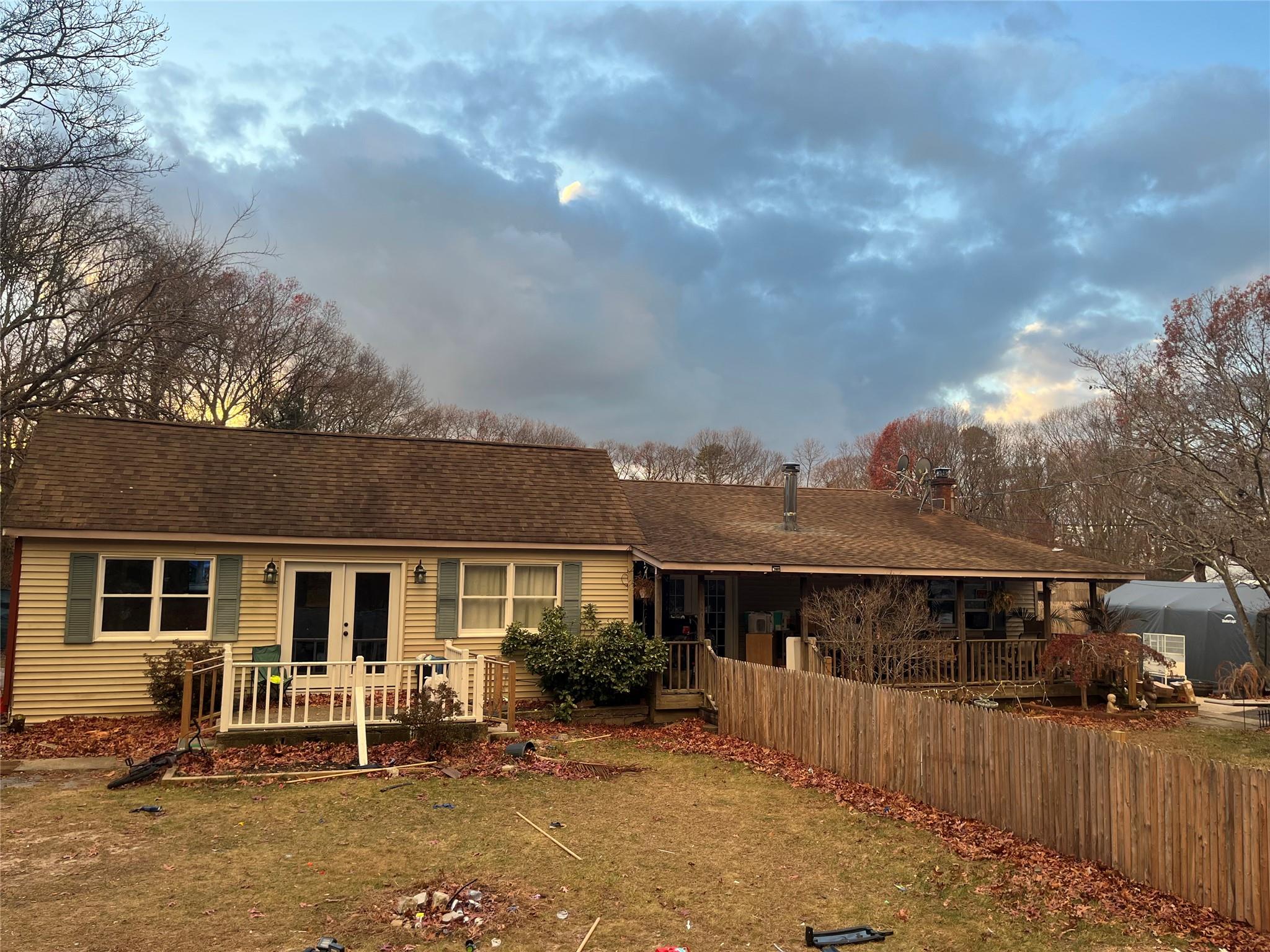 a view of house with outdoor seating space