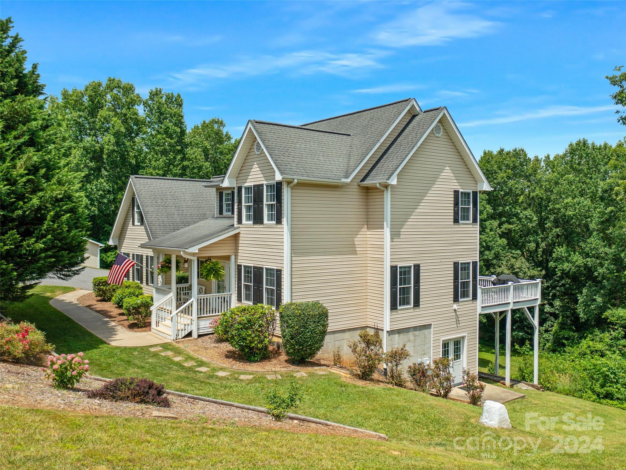 a front view of house with yard and green space