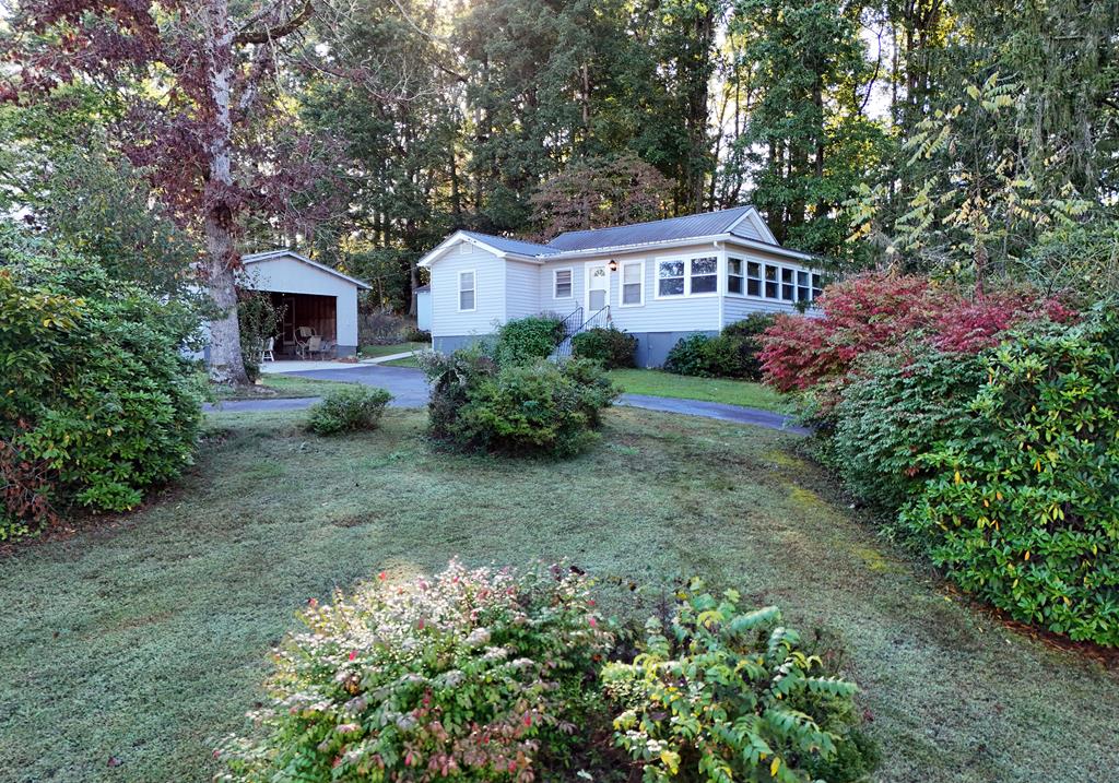 a front view of a house with garden