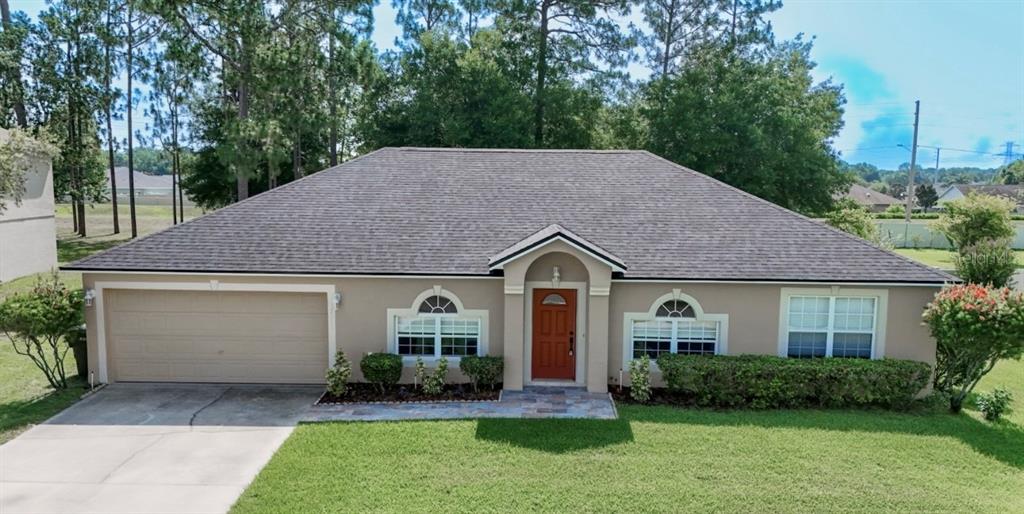 a front view of a house with a yard