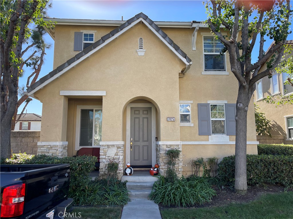 a front view of a house with garden