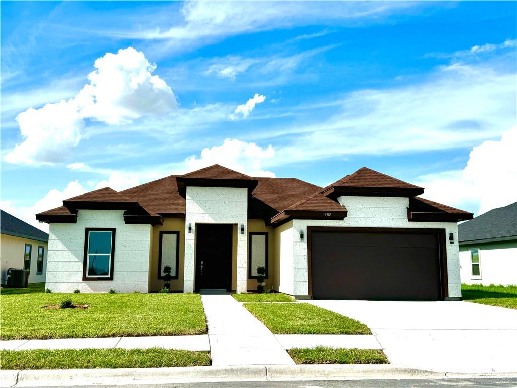 a view of house with yard and entertaining space