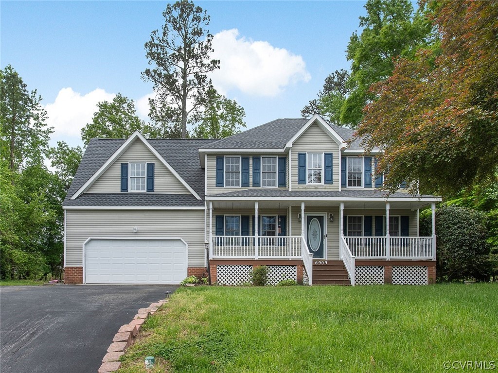 a house with a big yard and large trees