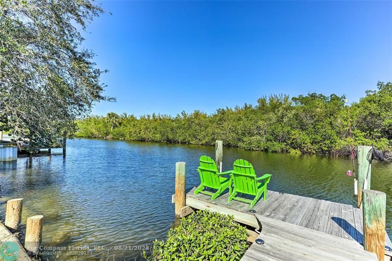 a lake view with a seating space