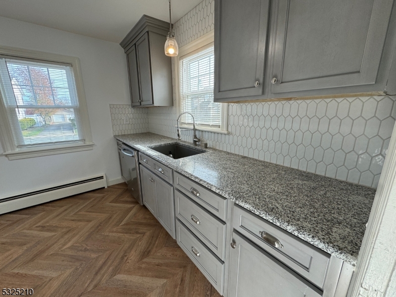 a kitchen with sink cabinets and window