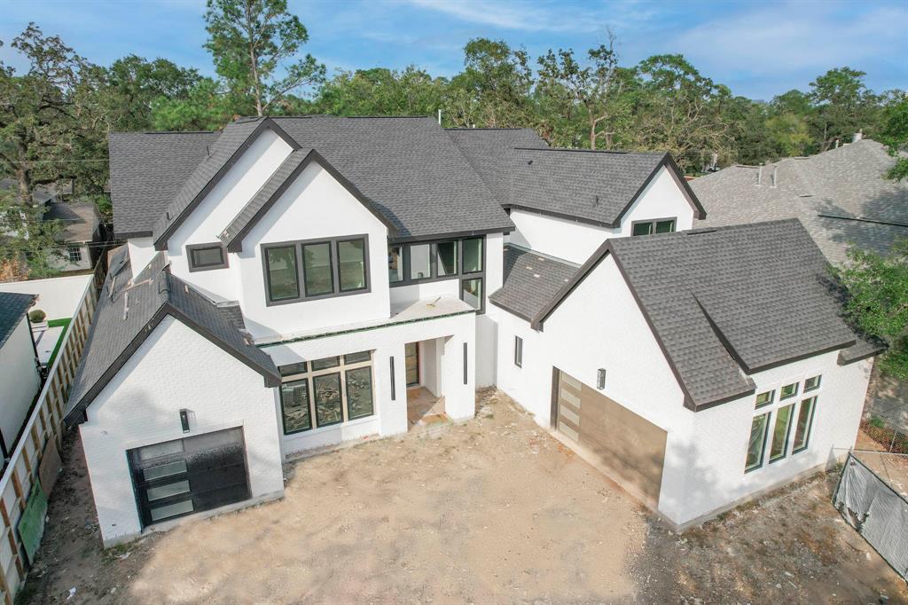 an aerial view of house with yard