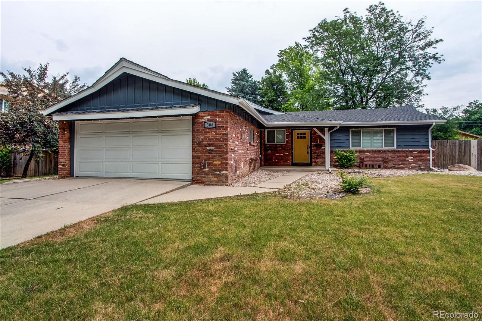 front view of a house with a yard