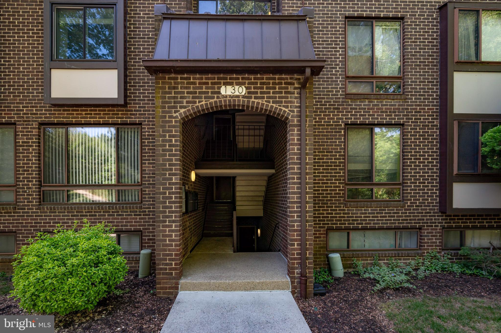 a brick building with a door and a window