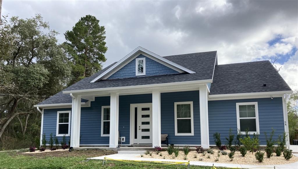 front view of a house with a yard