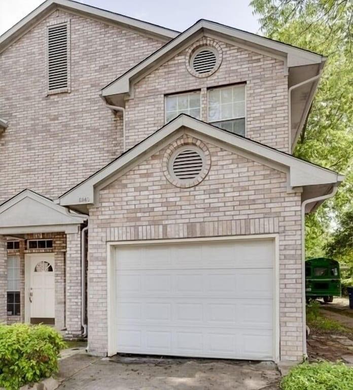 a front view of a house with a garage