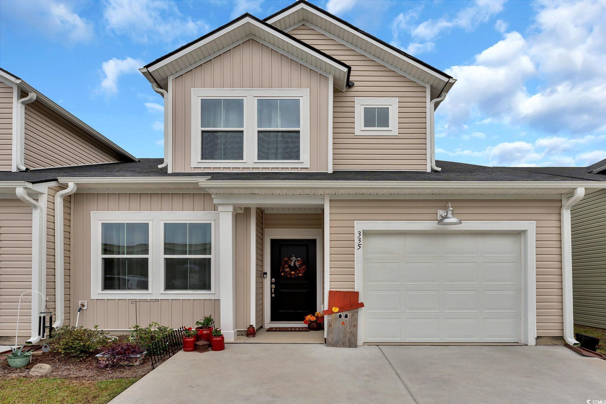 View of front property featuring a garage