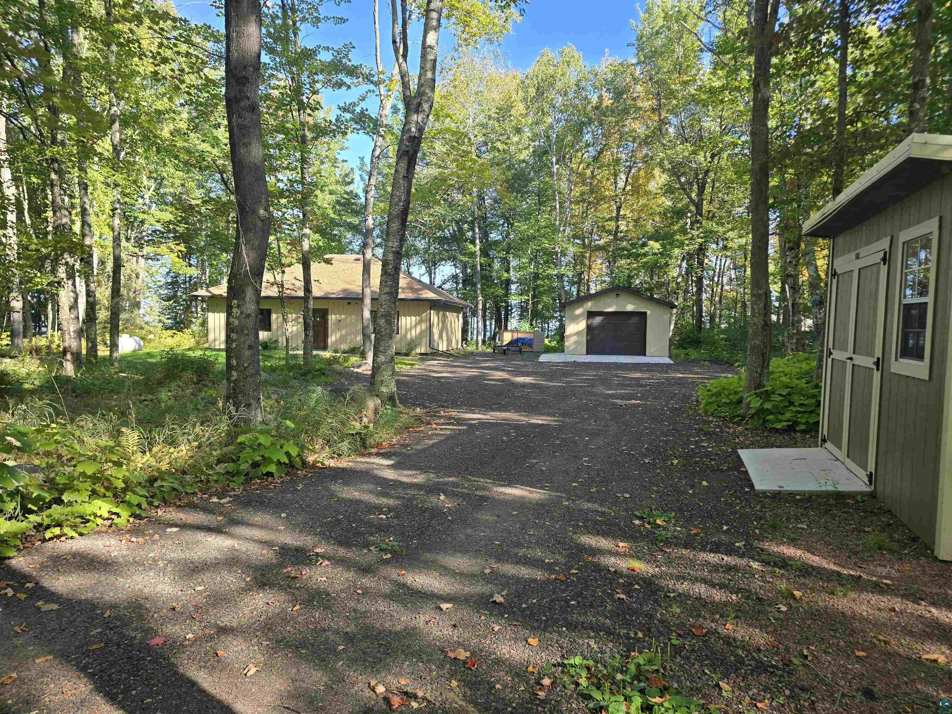 Exterior space with an outdoor structure and a garage