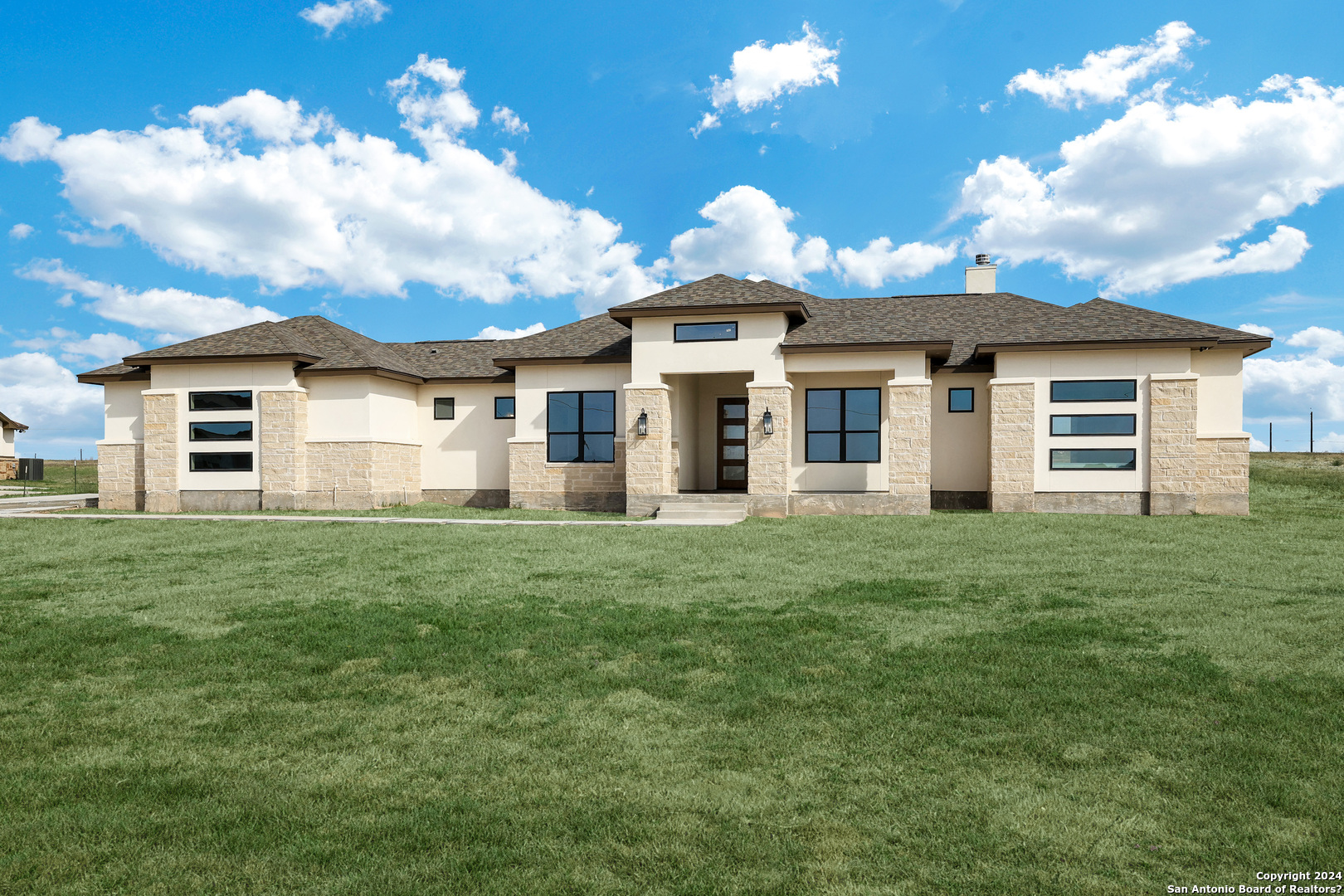 front view of a house with a yard