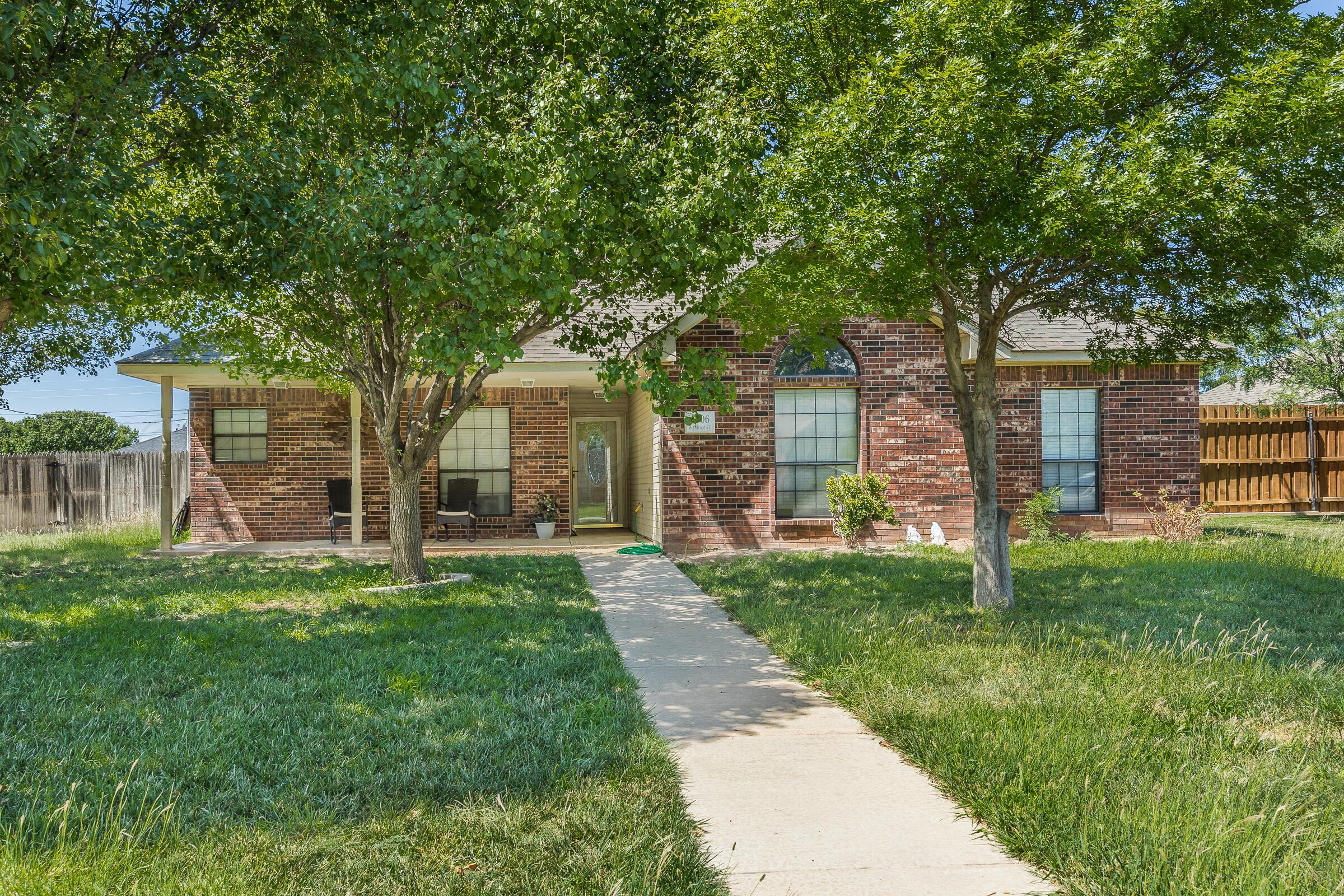 front view of a house with a yard