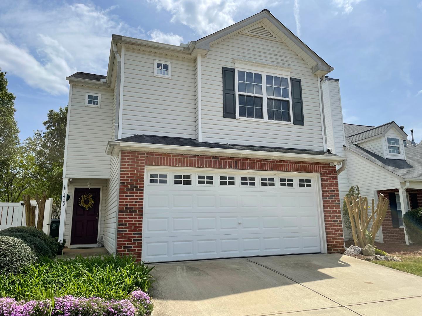 a front view of a house with a garage