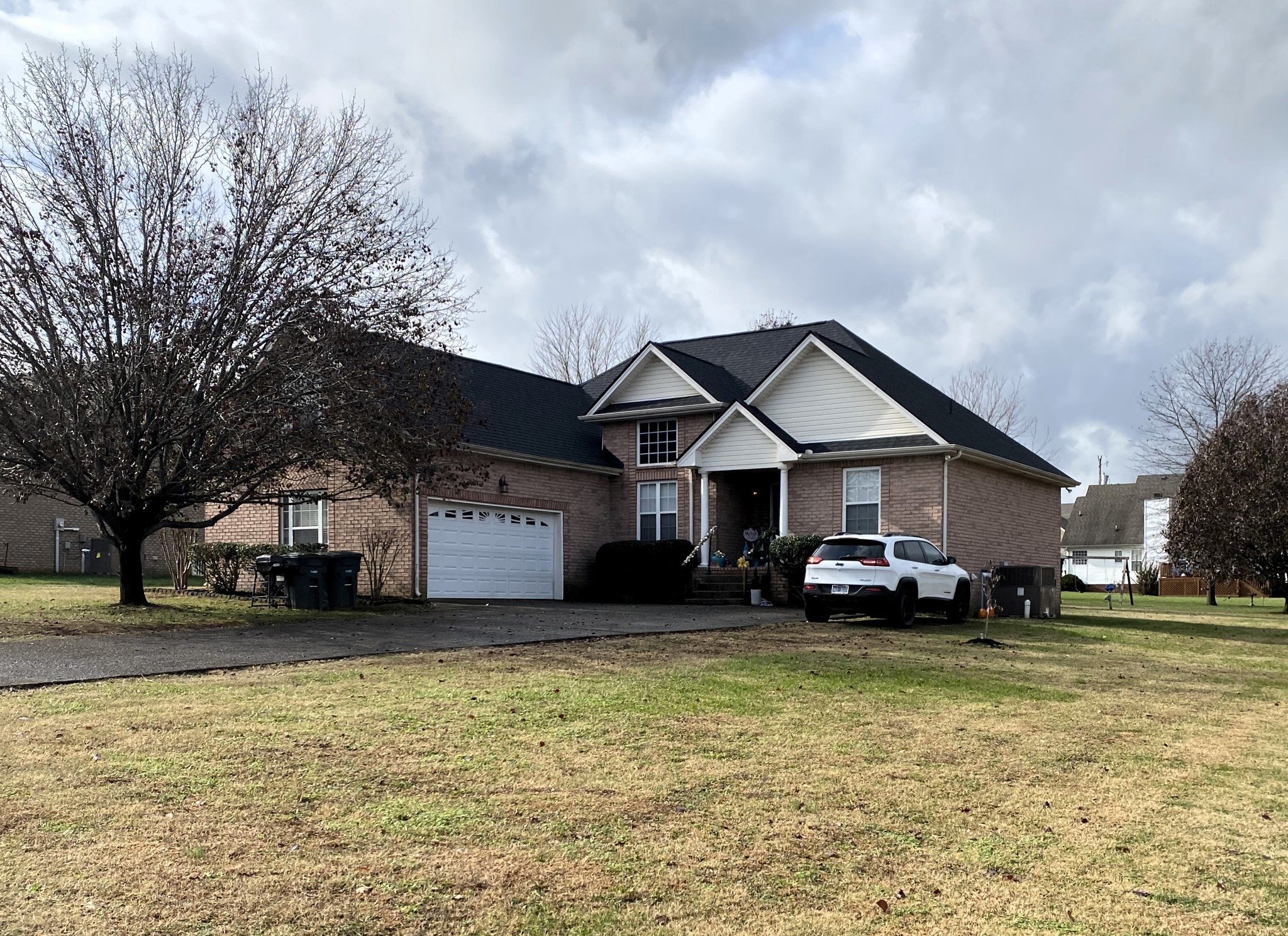 a front view of a house with a yard