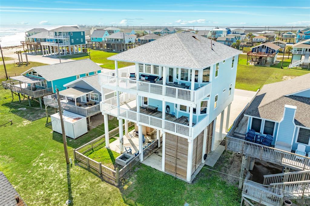 an aerial view of a house with a swimming pool