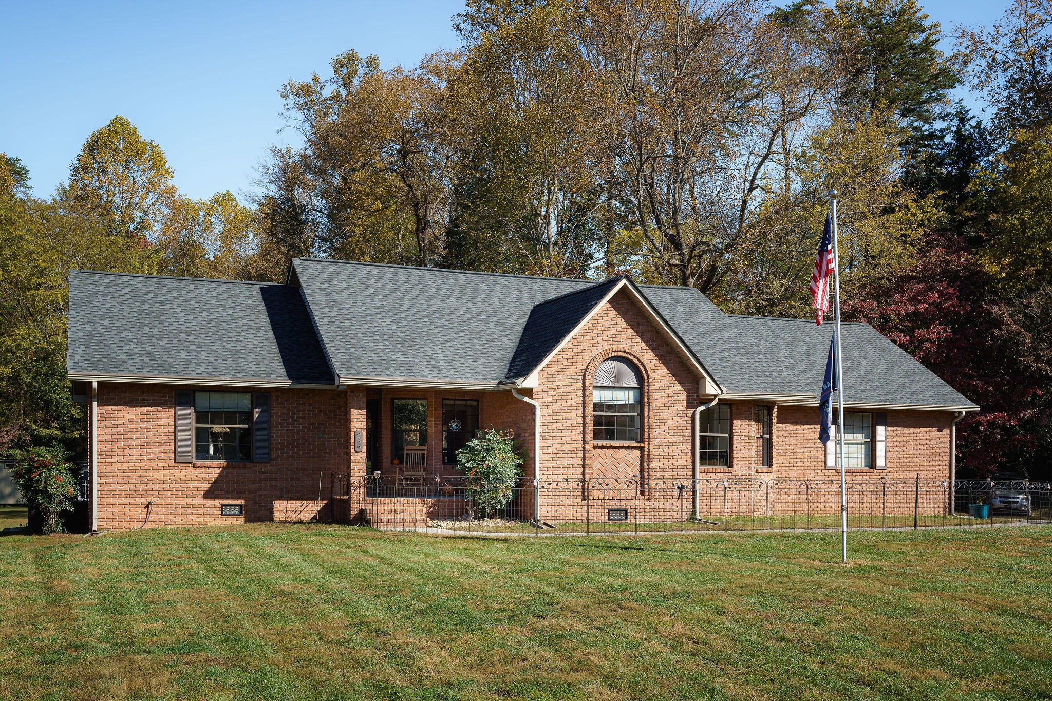 a front view of a house with a garden