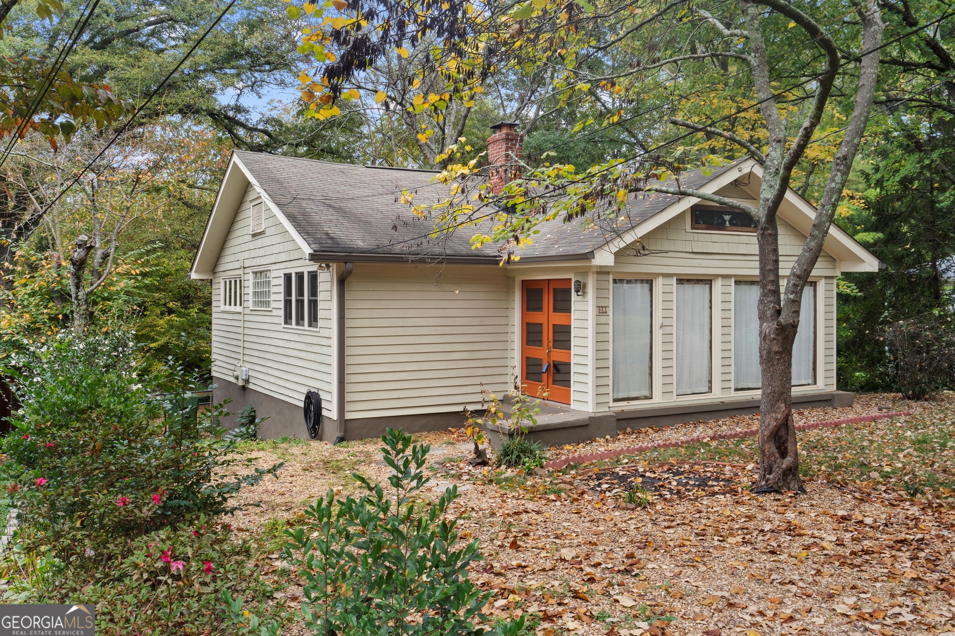 a house with a tree in the background